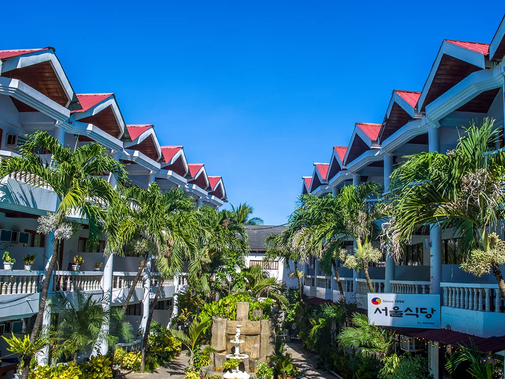 Boracay Peninsula resort wings with balconies and palms